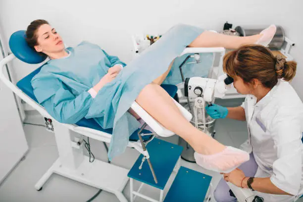 Woman during examination by a gynecologist. Having advise with her gynecologist. colposcopy