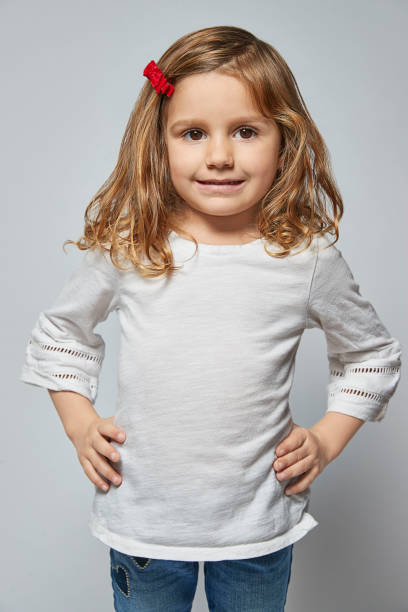 istock Girl in White Tshirt on a white background 1137067323