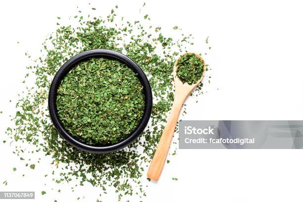 Dried Parsley Shot From Above On White Background Stock Photo - Download Image Now - Dry, Dried Food, Parsley