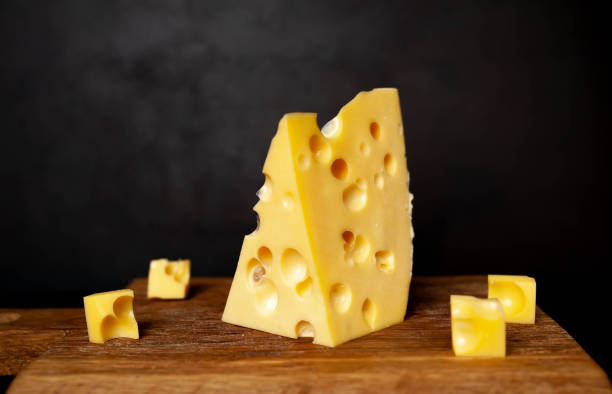istock delicious cheese on a cutting board, background stone 1137069460
