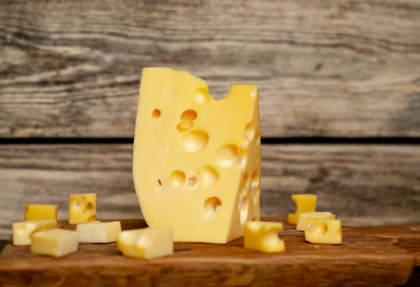 istock delicious cheese on a cutting board, background stone 1137069594