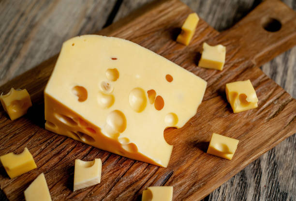 istock delicious cheese on a cutting board, background stone 1137069658
