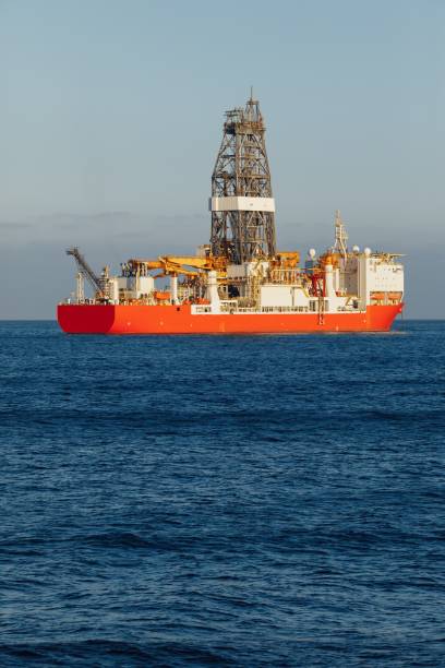 istock offshore oil and gas drillship, blue ocean background 1137069734