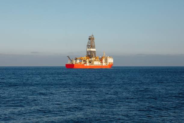 istock offshore oil and gas drillship, blue ocean background 1137069990