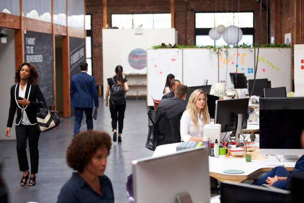 istock Business Team Working At Desks In Modern Open Plan Office 1137070231