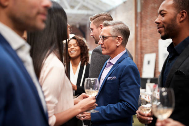 istock Business Team Socializing At After Works Drinks In Modern Office 1137070830