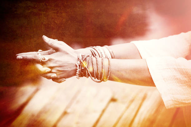 woman hands in yoga symbolic gesture woman hands in yoga symbolic gesture mudra  lot of bracelets and rings  mix with textures closeup mudra stock pictures, royalty-free photos & images