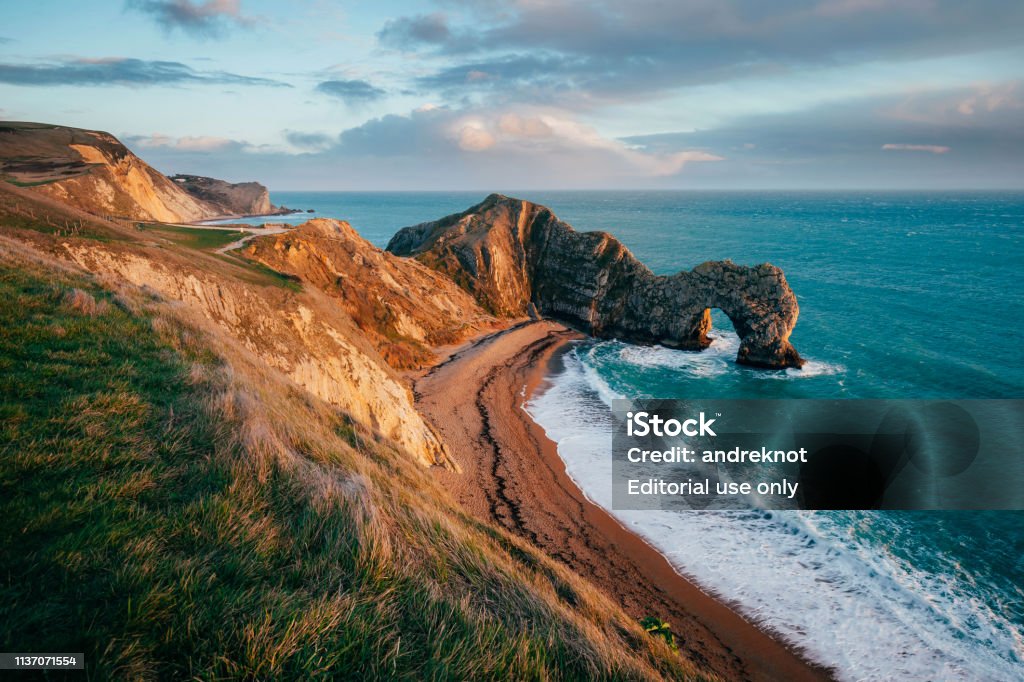 Durdle Door UK The famous Durdle Door arch in the south coast of UK at sunset Jurassic Coast World Heritage Site Stock Photo