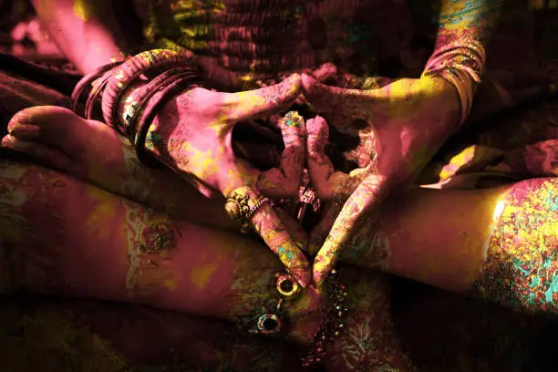 closeup of colorful woman hand in mudra gesture practice yoga outdoor shot