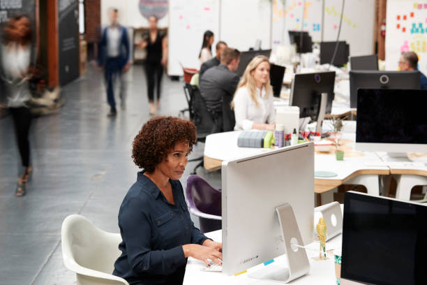 istock Business Team Working At Desks In Modern Open Plan Office 1137072517