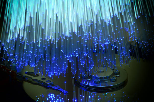 istock Details of opened computer hard disk drive with colored optic fiber. 1137072561