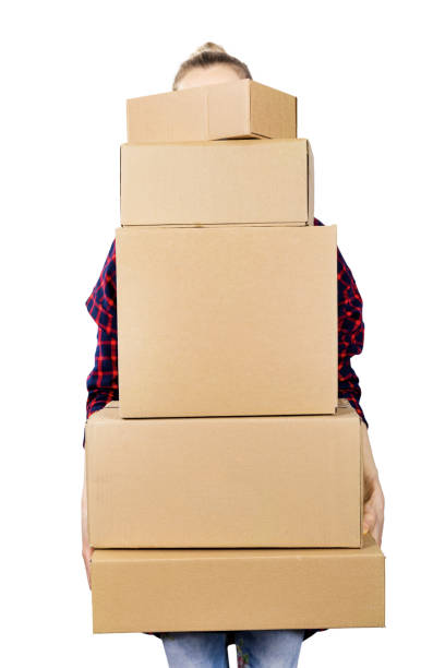 istock woman carrying stack of cardboard boxes on white background 1137072689