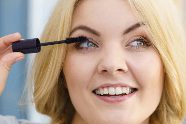 istock Woman using mascara on her eyelashes 1137079810