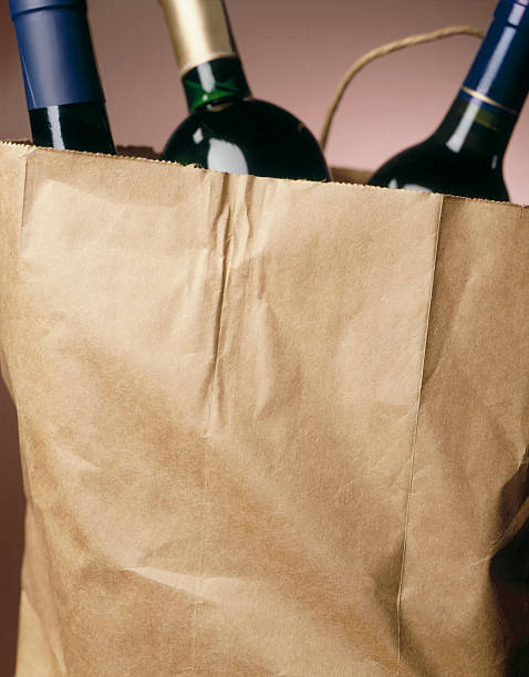 istock bottles of wine in a bag 113708049