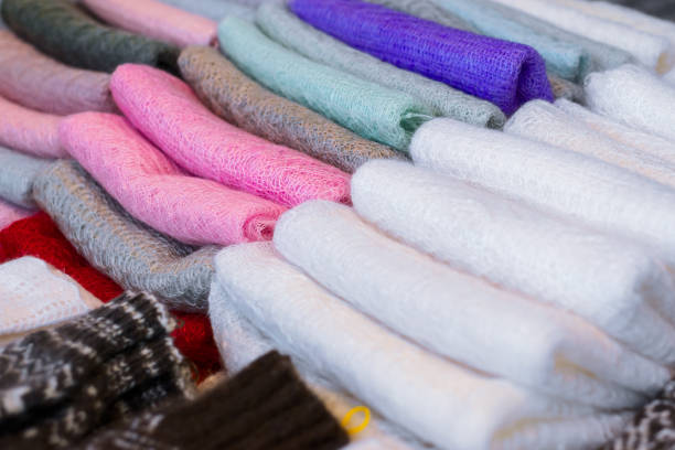 istock Multicolored woolen scarves are folded in the firebox. 1137082460