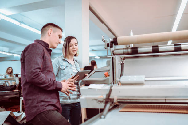 istock Female Supervisor Reviewing Machine Quality In Front Of Boss 1137084886