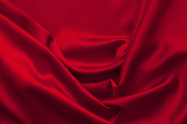 istock Luxury red satin fabric cloth abstract background 1137085245