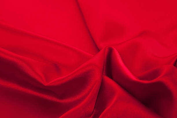 istock Luxury red satin fabric cloth abstract background 1137085806