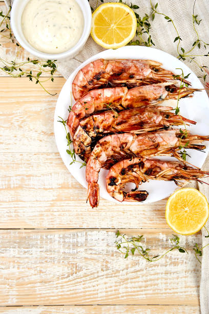 istock Grilled big tiger shrimps prawns on white plate 1137085839