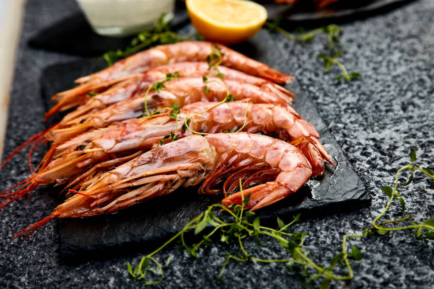istock Grilled big tiger shrimps prawns on black slate plate 1137085844