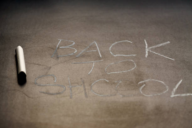 istock Back to school background.  White chalk text on school blackboard. Shallow depth of field 1137088235