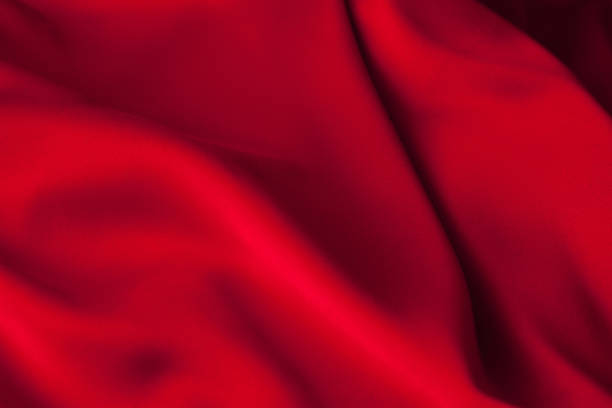 istock Luxury red satin fabric cloth abstract background 1137088705