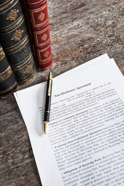 istock Non-Disclosure Agreement with Pen and Law Books 1137088929
