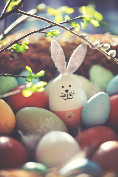 istock Easter decoration with crafted Easter bunny in the sunny nest 1137089384