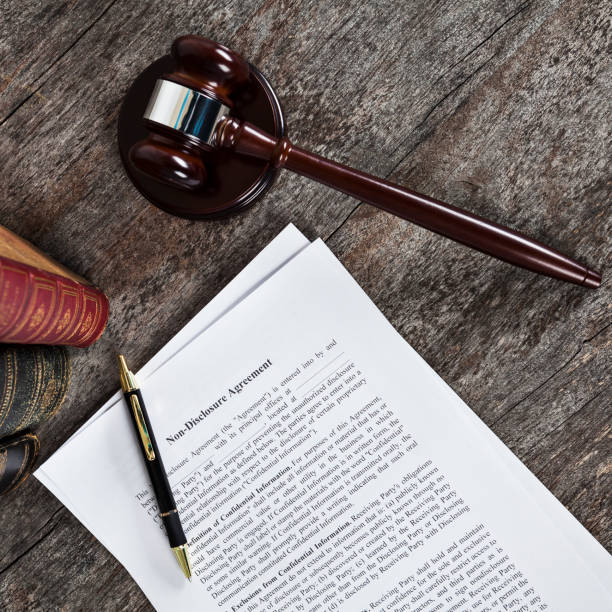 istock Non-Disclosure Agreement with Pen, Law Books and Gavel 1137089391