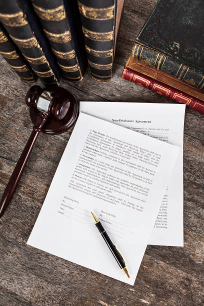 istock Non-Disclosure Agreement with Pen, Law Books and Gavel 1137089441