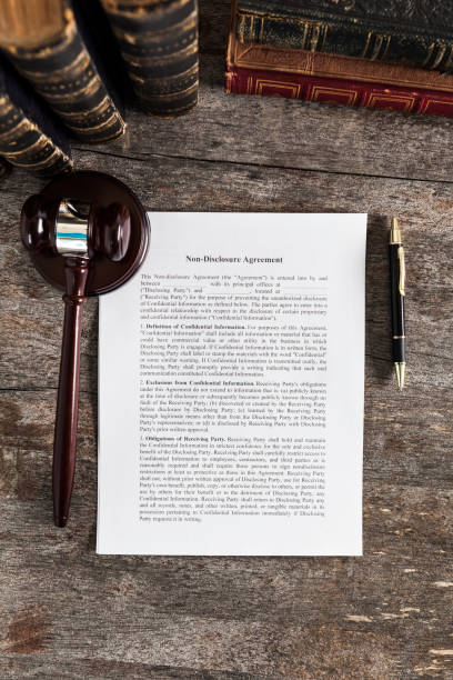 istock Non-Disclosure Agreement with Pen, Law Books and Gavel 1137090168