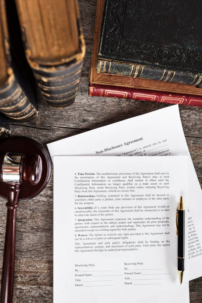istock Non-Disclosure Agreement with Pen, Law Books and Gavel 1137090884