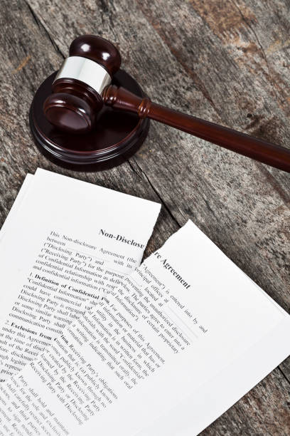 istock Ripped Non-Disclosure Agreement with Gavel 1137091512