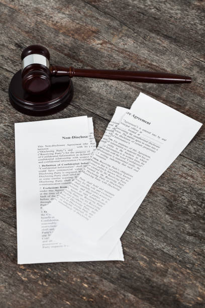 istock Ripped Non-Disclosure Agreement with Gavel 1137091601