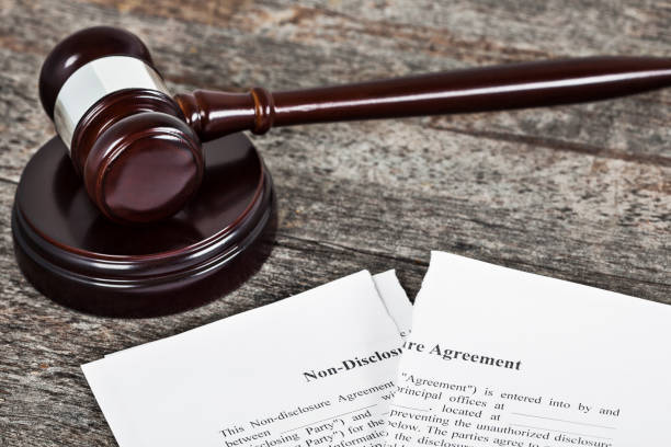 istock Ripped Non-Disclosure Agreement with Gavel 1137091622