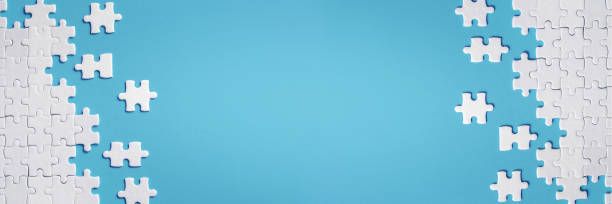 istock White details of puzzle on blue background 1137092001