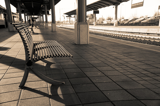 Empty train station, iron chair or bench in empty platform