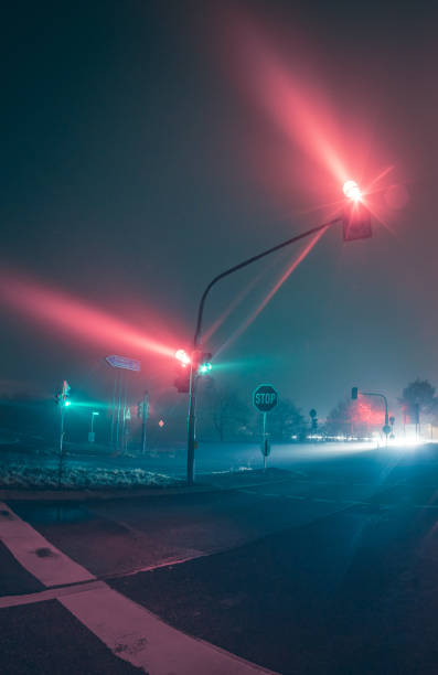istock traffic lights in fog at night 1137094258