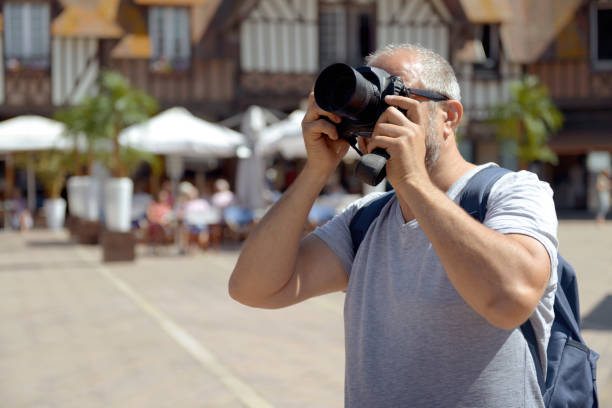 istock Man walks in France (with a camera) 1137095800