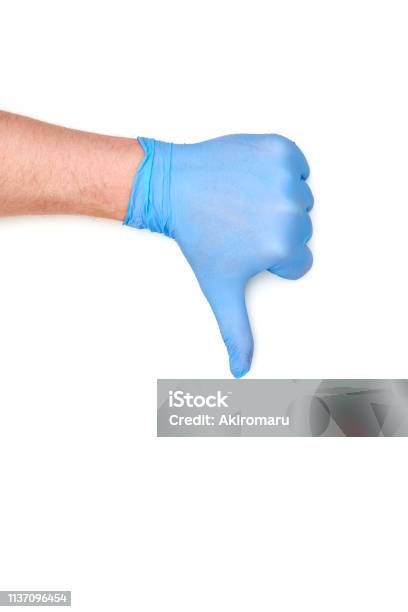 Thumb In Latex Surgical Glove Showing Dislike Sign Stock Photo - Download Image Now - Adult, Arguing, Arm