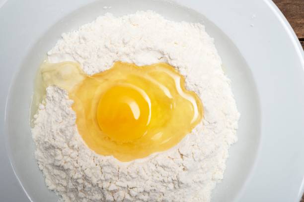 istock Close up of egg in flour 1137099022