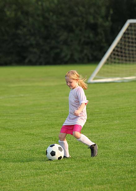 istock girl playing soccer 113710287