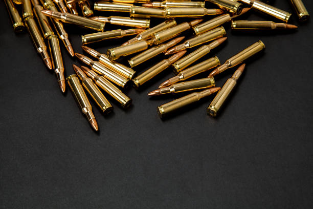 istock Rifle cartridges on a black background 1137105551