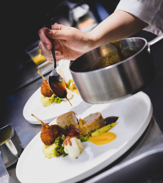 istock Chef preparing food, meal, in the kitchen, chef cooking, Chef decorating dish 1137106831