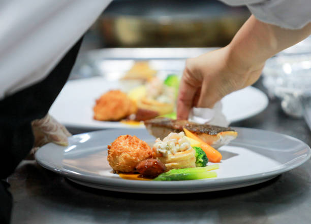 istock Chef preparing food, meal, in the kitchen, chef cooking, Chef decorating dish 1137106833