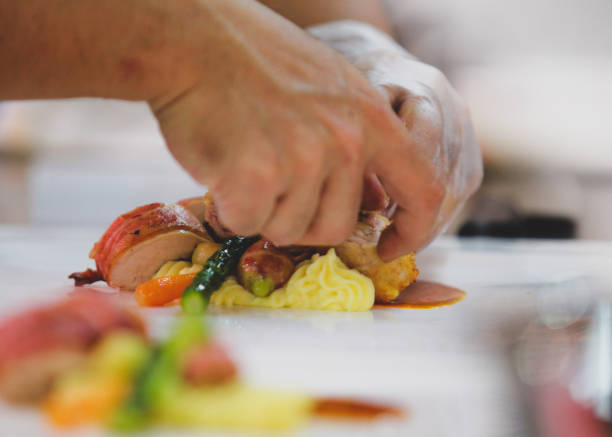 istock Chef preparing food, meal, in the kitchen, chef cooking, Chef decorating dish 1137106845