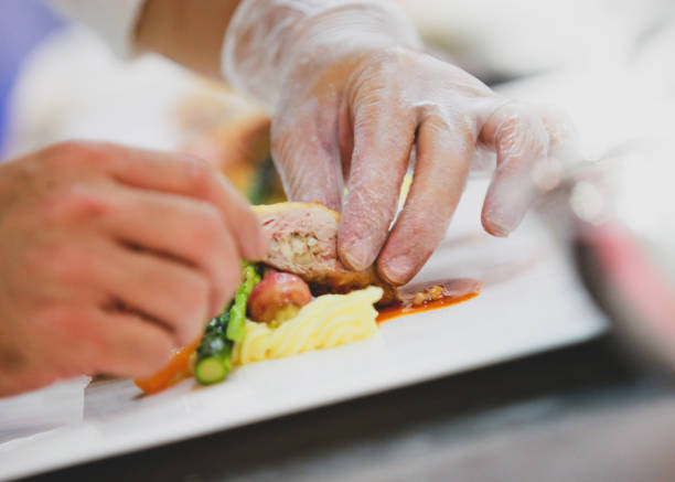 istock Chef preparing food, meal, in the kitchen, chef cooking, Chef decorating dish 1137106854