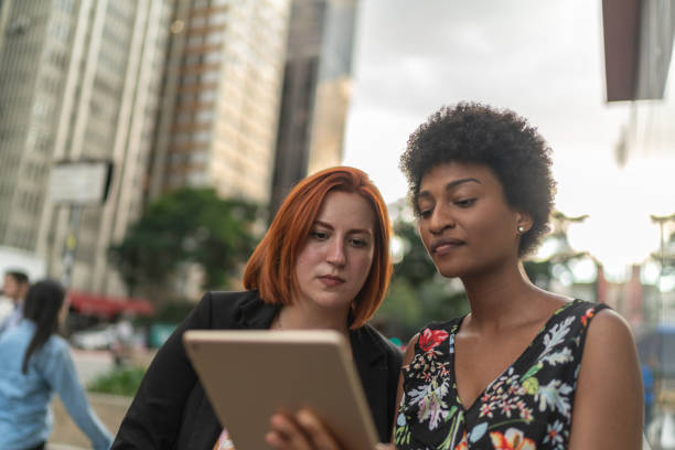 istock Business partners using tablet on the city 1137109911