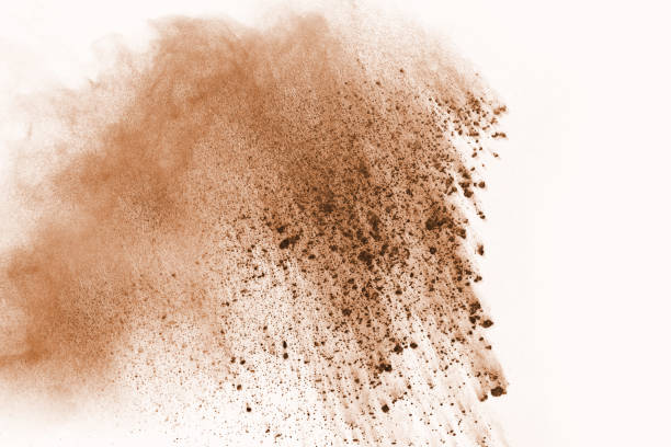 istock Brown color powder explosion on white background. Colored cloud. Colorful dust explode. Paint Holi. 1137110203