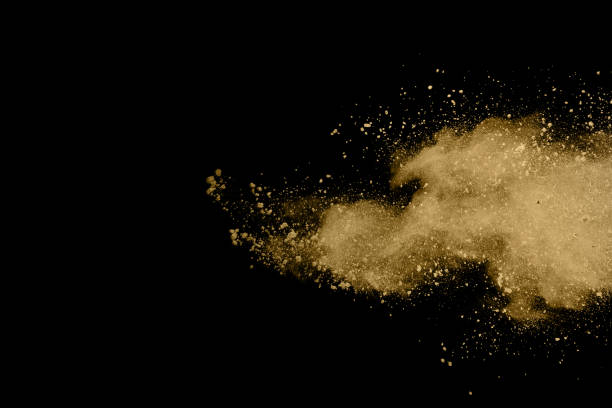 istock Golden powder explosion on black background. Freeze motion. 1137110337
